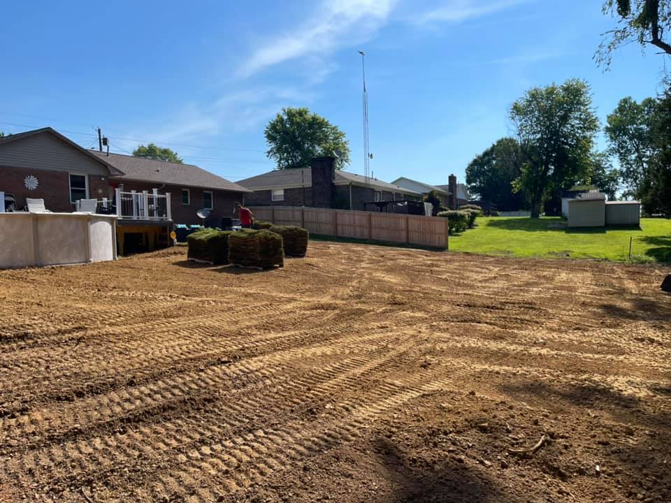 Graded and prepped lot with curbing and dirt work performed by The Muscle